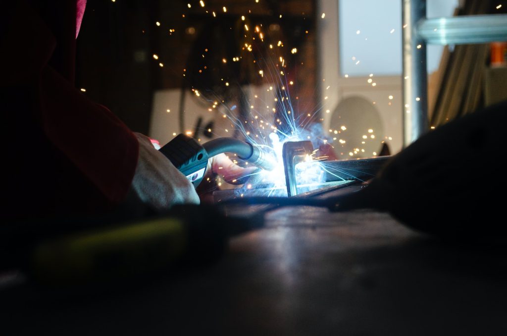 a person using a welding machine on a table
